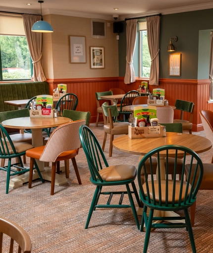 The interior restaurant seating area with tables and chairs at The Farmhouse Kitchen Willington.