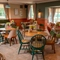 The interior restaurant seating area with tables and chairs at The Farmhouse Kitchen Willington.