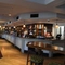 Interior dining area of a pub with a bar.