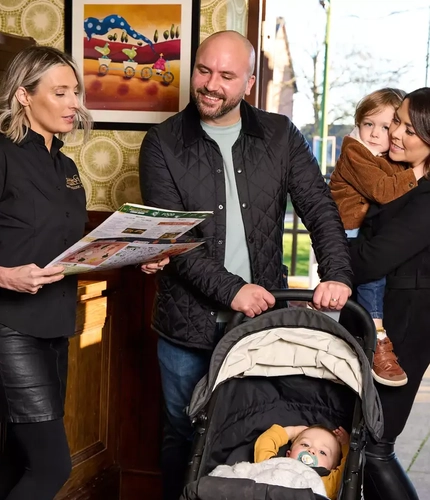 Family walking into a Farmhouse Inn