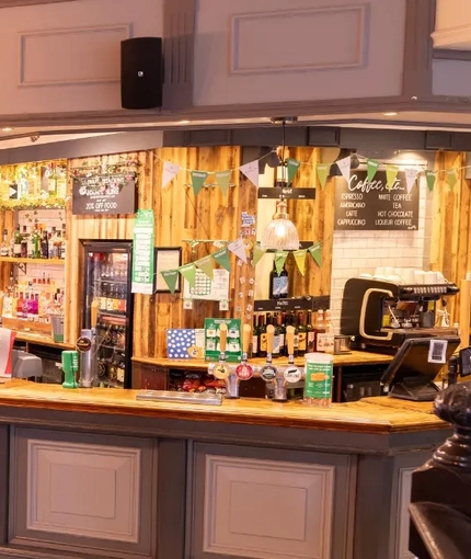 The interior restaurant and seating area with bar at the Brentwood.