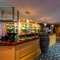 Interior dining area of a pub with a bar.