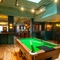 The interior games area at the Lord Raglan, with a pool table, and a view of the bar.