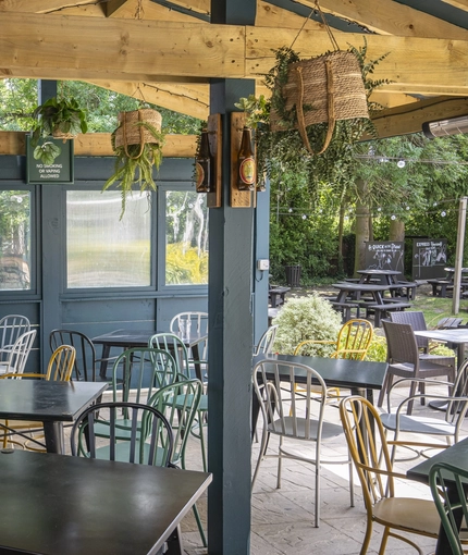 The exterior undercover beer garden seating area at The Crown & Horseshoes.