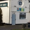 The exterior of The Charnwood Arms and some beer garden benches.