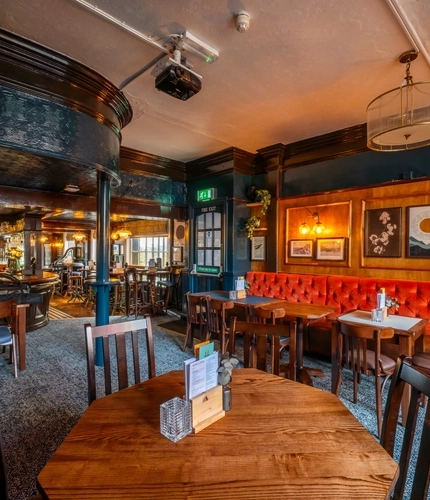 The interior restaurant seating area at The Sussex Arms.