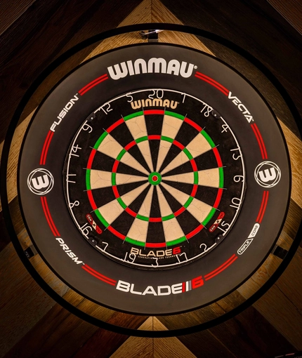 The interior pub games area focusing on a dart board available to use at the Armstrongs.