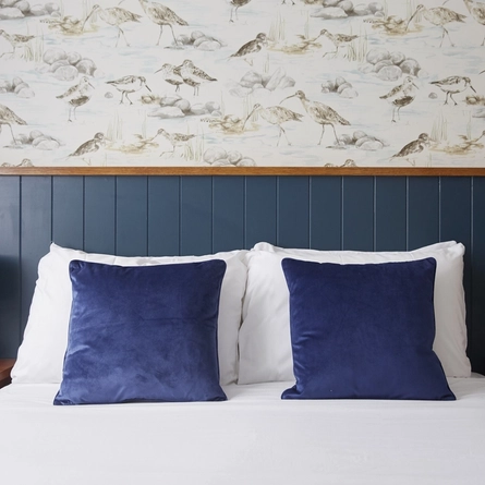 a close-up of a double bed in a room of a hotel