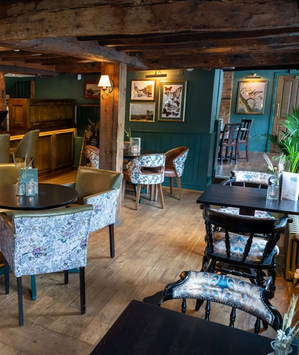 The interior restaurant and seating area with bar at the Vauxhall Inn.