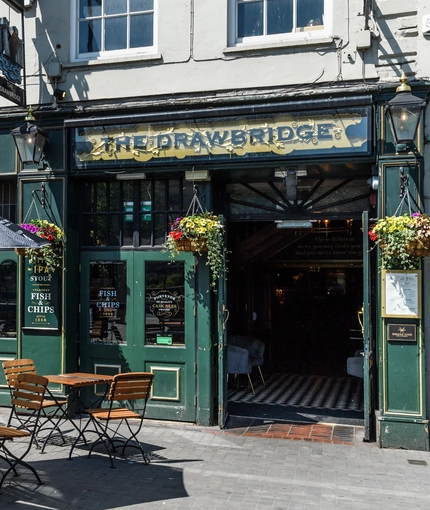 External view of a pub entrance and beer garden