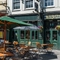 External view of a pub entrance and beer garden