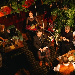 An image of people enjoying a live performance at the Ubiquitous Chip in Glasgow.