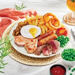 Food presented on a plate sat on a woven place mat with a napkin