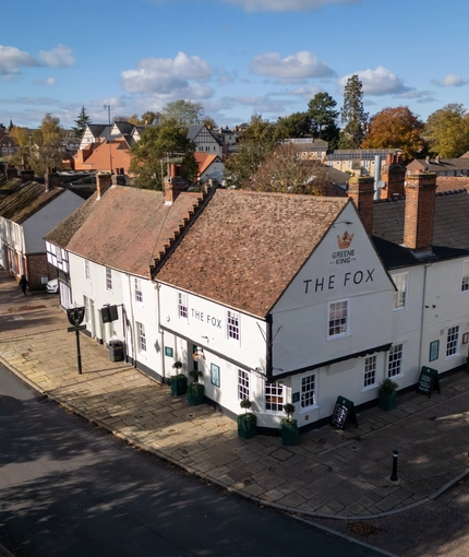 An aerial view of the exterior facade of The Fox in Bury St Edmunds, and the surrounding streets.