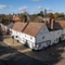 An aerial view of the exterior facade of The Fox in Bury St Edmunds, and the surrounding streets.