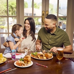 A family enjoying a meal at a Farmhouse Inns venue.