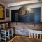 interior dining area of a pub with a dartboard