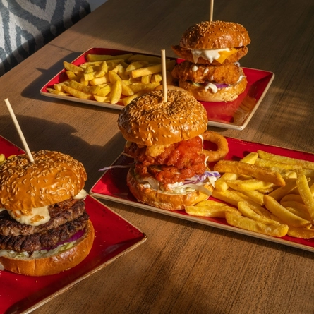 A served selection of burgers  available on the Hungry Horse Autumn Winter menu.