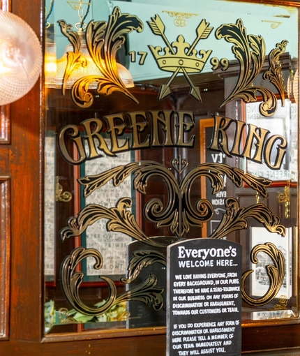 The interior decor in the restaurant at the Two Brewers including decorative mirrors and plants.