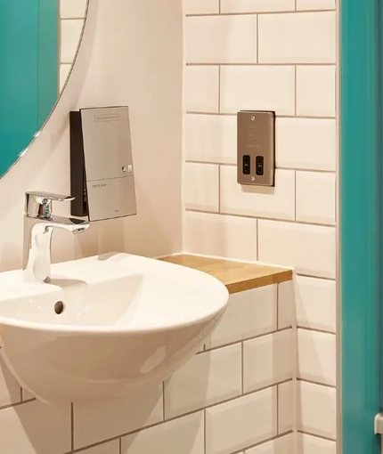 The interior of one of the hotel room bathrooms at The Churchill.