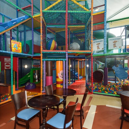 Interior play area of a pub with a dining area.