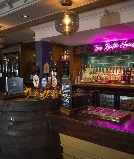 Interior bar area with a barrel next to the bar as part of the decor
