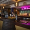 Interior bar area with a barrel next to the bar as part of the decor