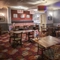 Interior dining area of a pub with a TV.