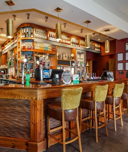 Interior bar of a pub with stools.