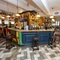 Interior dining area and bar area of a pub.