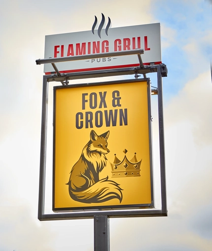 A close up of the exterior signage of The Fox and Crown in Sutton-in-Ashfield.
