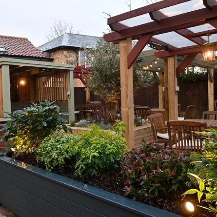 The exterior beer garden and seating area at the White Hart.
