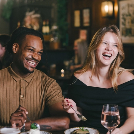 Couples enjoying a valentines meal at a Greene King Heritage vanue.