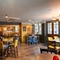 Interior dining area of a pub with a TV.
