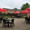 exterior beer garden of a pub with a seating area and a play area