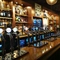 Bar with lots of bottles placed neatly in a row