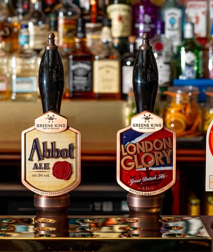 An image of the interior bar focusing on the pump taps at The Lucas Arms.