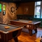 The interior pub games area with 2 pool tables and TV at the Ship and Royal.