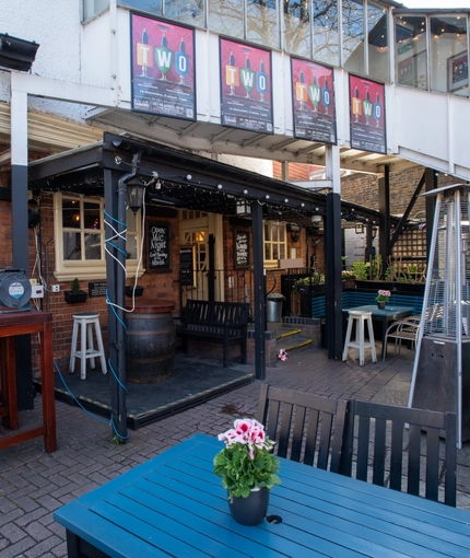 exterior beer garden with seating area
