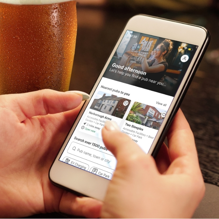 A phone with the Greene King app