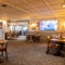 The interior restaurant and seating area with TV at the Poachers 