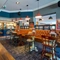 Interior dining area of a pub with a bar.