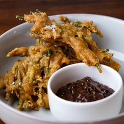 Samphire pakoras with a pot of date and tamarind chutney