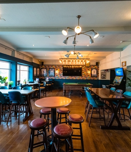 Interior seating area and pool table  of the Cricketers in Southwick