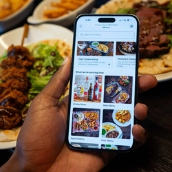 Someone ordering from the Greene King app at Flaming Grill.