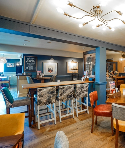 The restaurant area of the Woodman Inn.