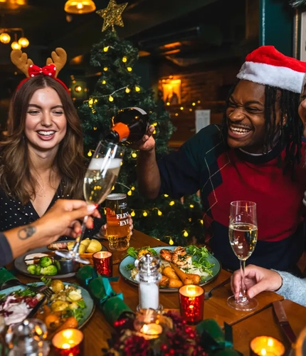 Friends enjoying a festive meal together