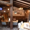 Interior dining area of a pub with a TV.