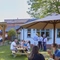 An image of people enjoying the exterior beer garden seating area at The Drum and Monkey.