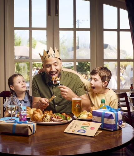 A family celebrating Father's day at Farmhouse Inns.